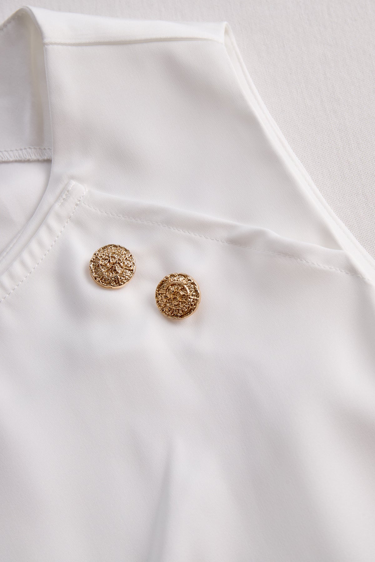 Elegant White Draped Top with Button Detail